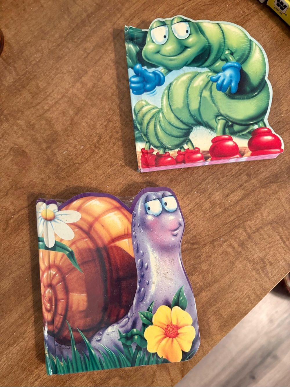 Children's Board Notebook Pages with Colorful Snail and Caterpillar Artwork